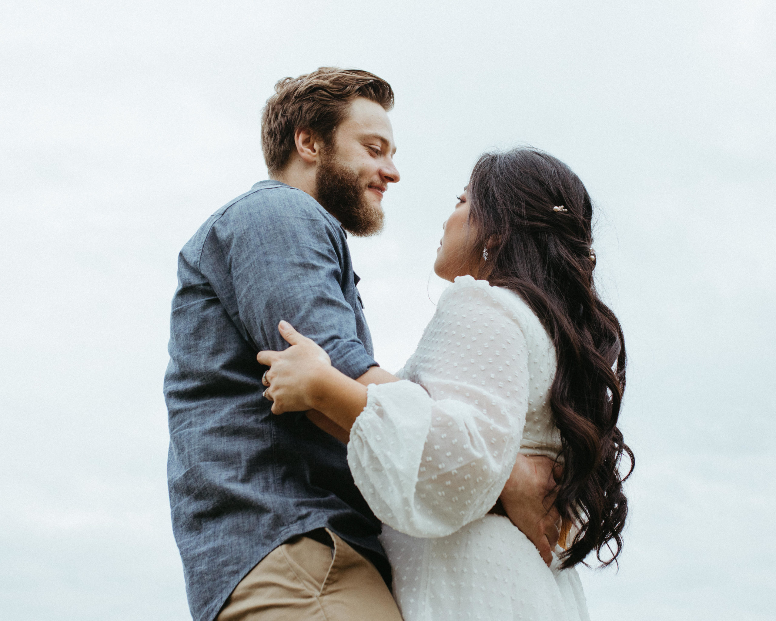 A couple staring into each others' eyes.